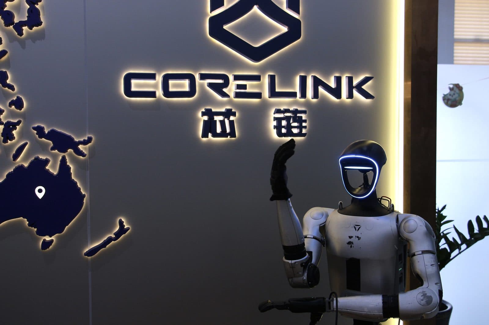 Lobby guidance — humanoid greeting in the CORELINK showroom